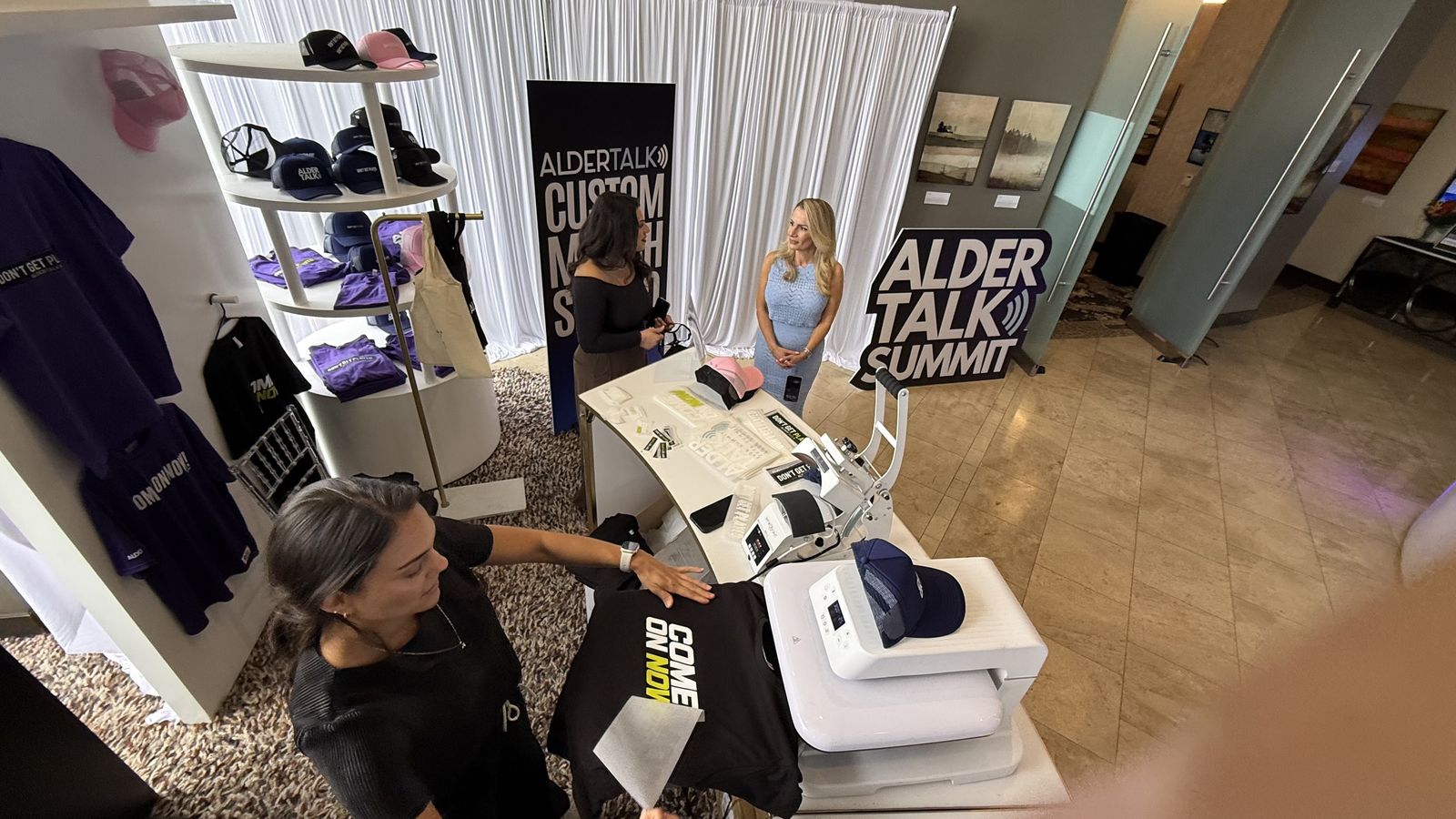 Merch Troop live screen-printing station running at a San Antonio event
